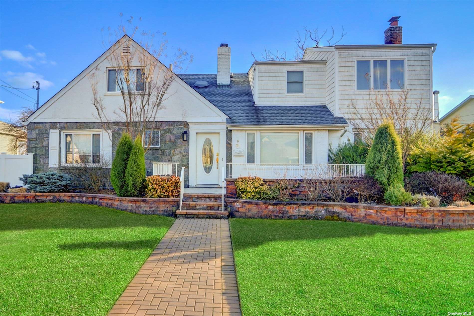 31 Eden Road Long Beach, NY 11561 - Photo 1 of 1 a front view of a house with a yard and potted plants