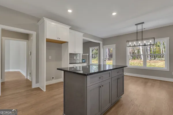 a view of cabinets and wooden floor