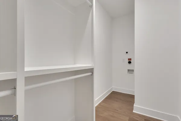 a view of an empty room with a fan