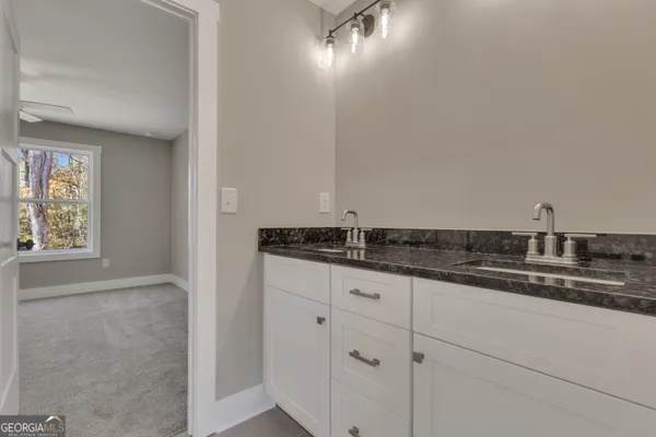 a view of swimming pool with large trees