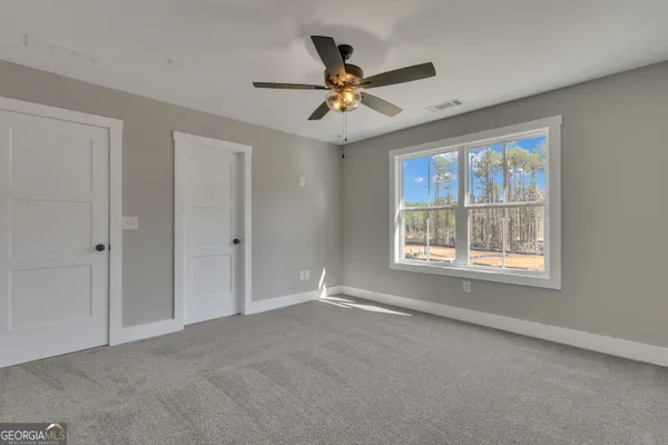 a view of a house with a snow in the yard