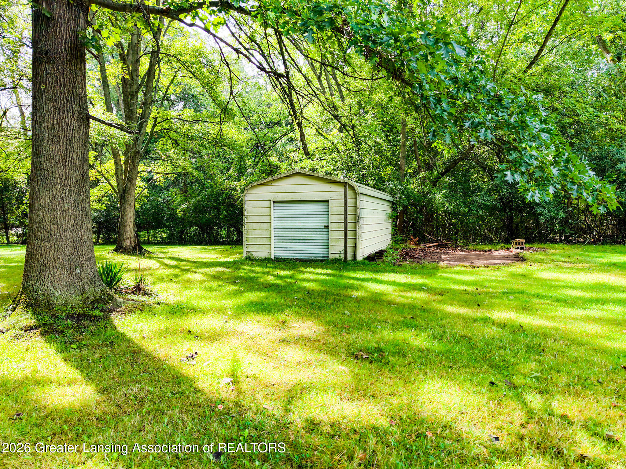 4497 Meridian Road Okemos, MI 48864 - Photo 39 of 58 DJI_20260910111841_0022_D