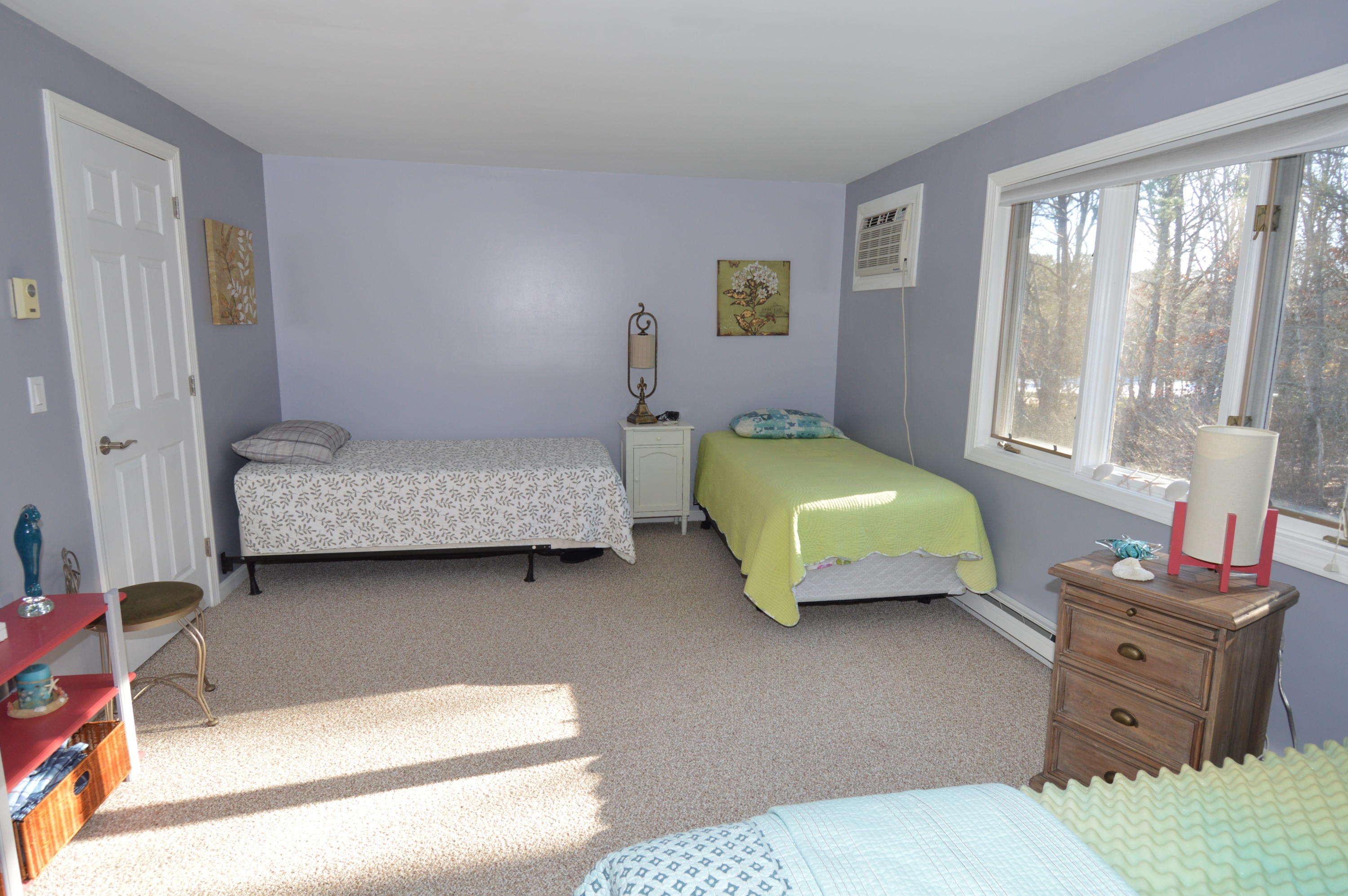 174 Lowell Road, Unit T30 Mashpee, MA 02649 - Photo 12 of 19 a bedroom with two beds and large windows