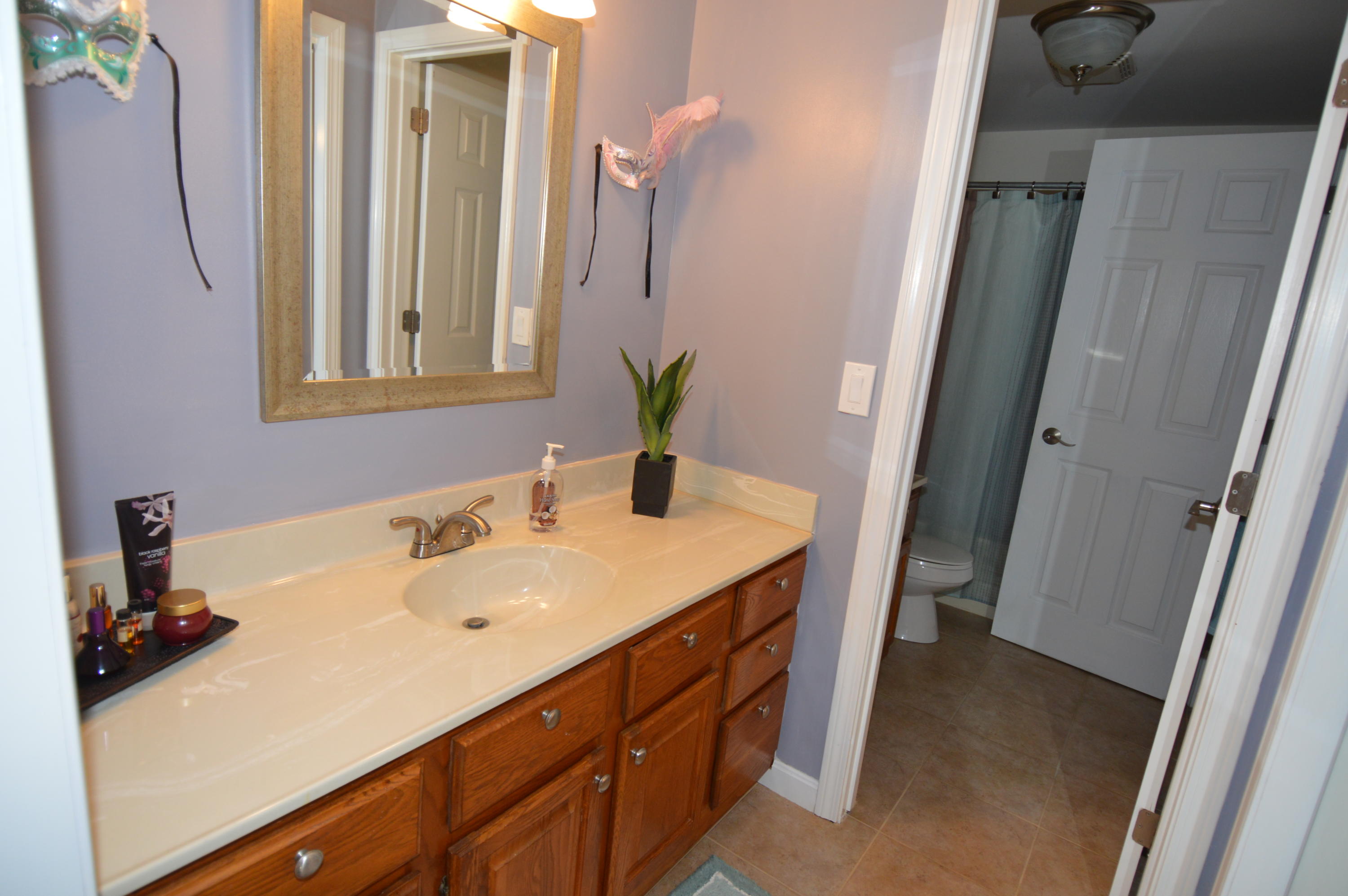 174 Lowell Road, Unit T30 Mashpee, MA 02649 - Photo 14 of 19 a bathroom with a sink and a mirror