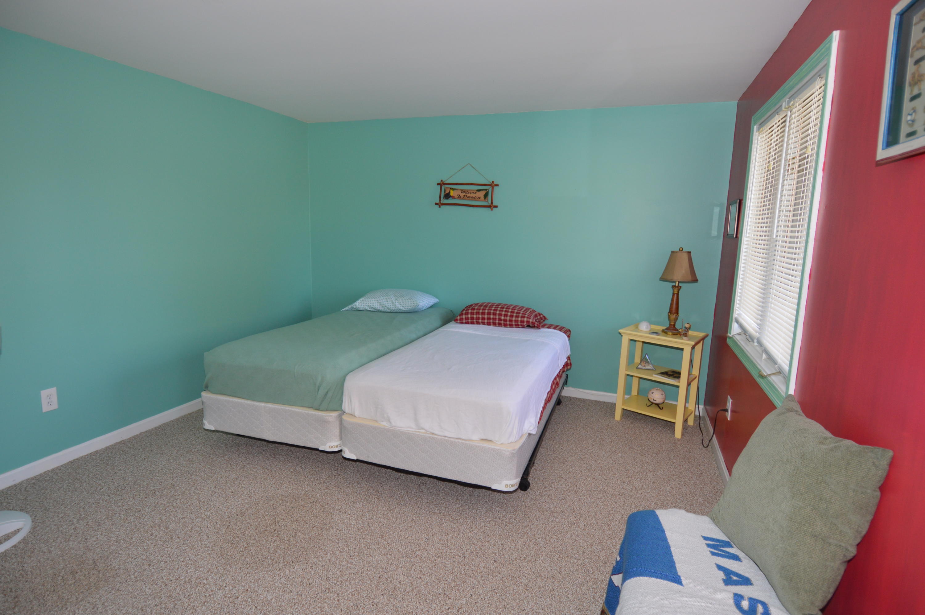 174 Lowell Road, Unit T30 Mashpee, MA 02649 - Photo 17 of 19 a bedroom with a bed and a window