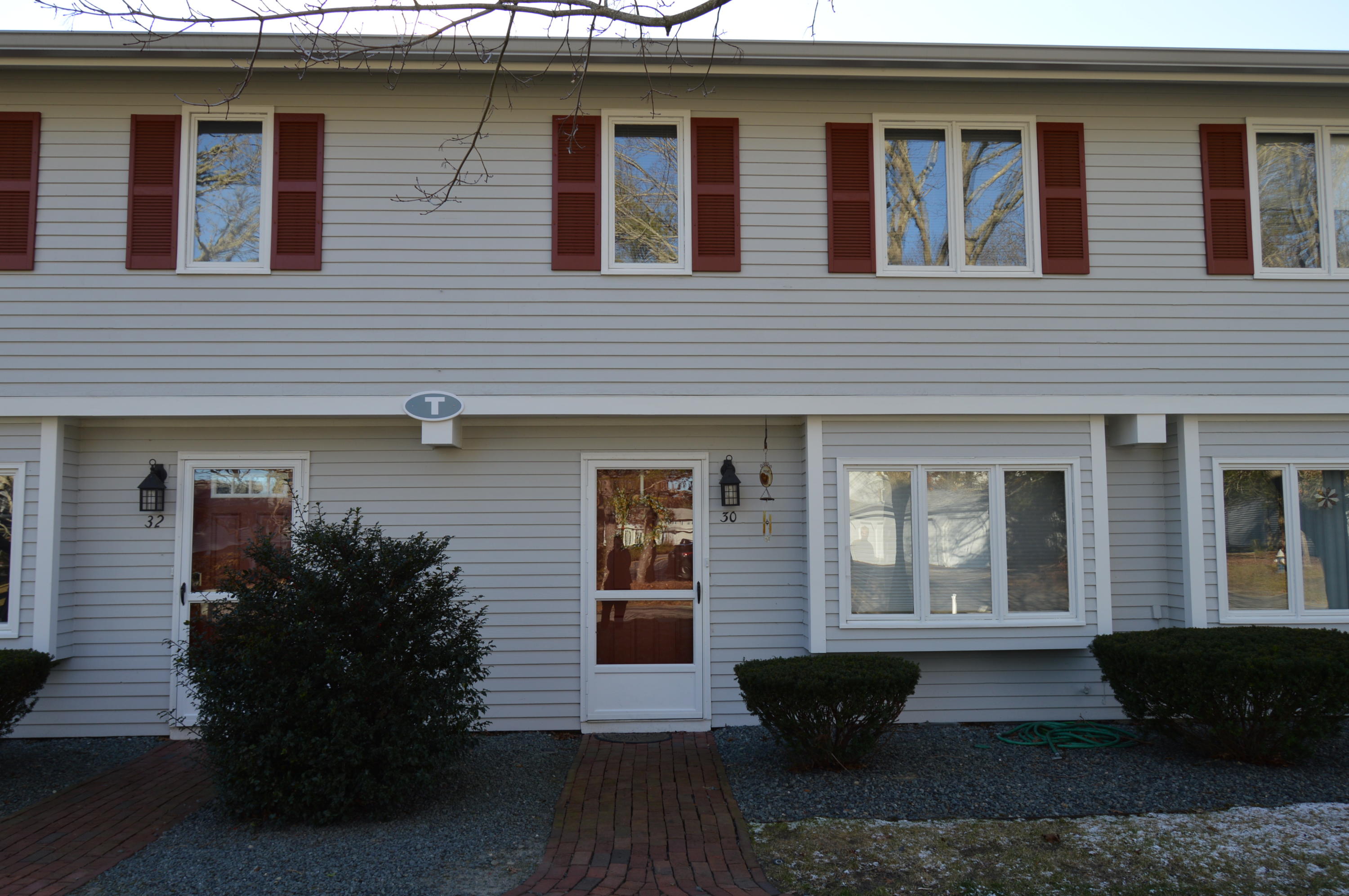 174 Lowell Road, Unit T30 Mashpee, MA 02649 - Photo 3 of 19 a front view of a house