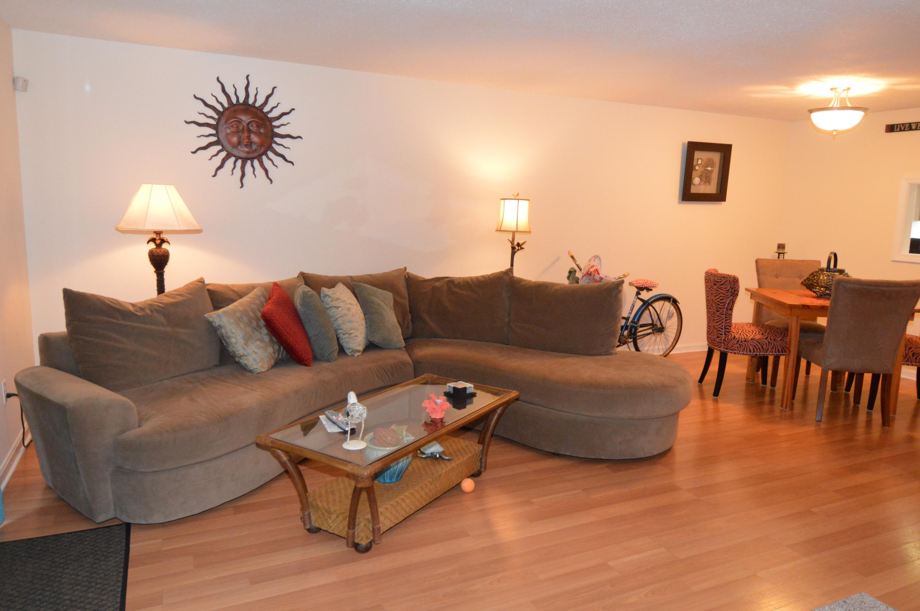174 Lowell Road, Unit T30 Mashpee, MA 02649 - Photo 7 of 19 a living room with furniture and a lamp