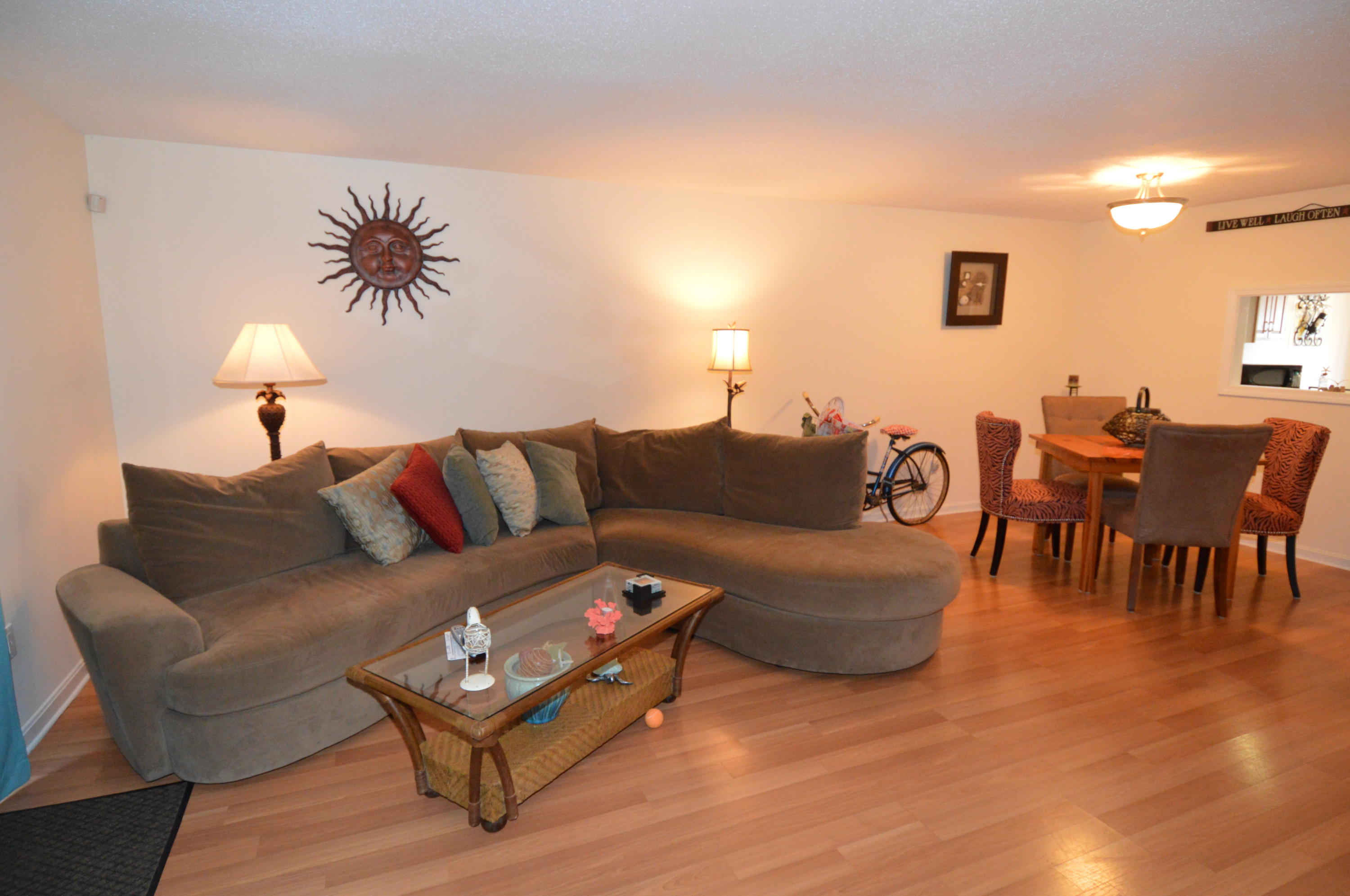 174 Lowell Road, Unit T30 Mashpee, MA 02649 - Photo 10 of 19 a living room with furniture and a wooden floor