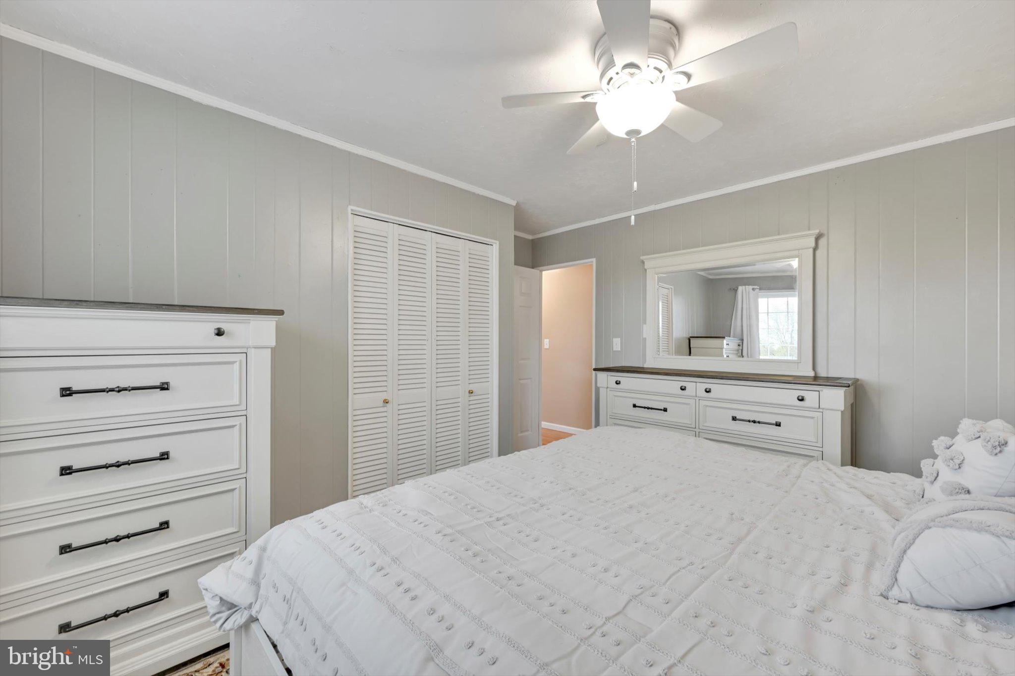116 Swarthmore Drive Lititz, PA 17543 - Photo 16 of 34 a bedroom with a bed and a chandelier