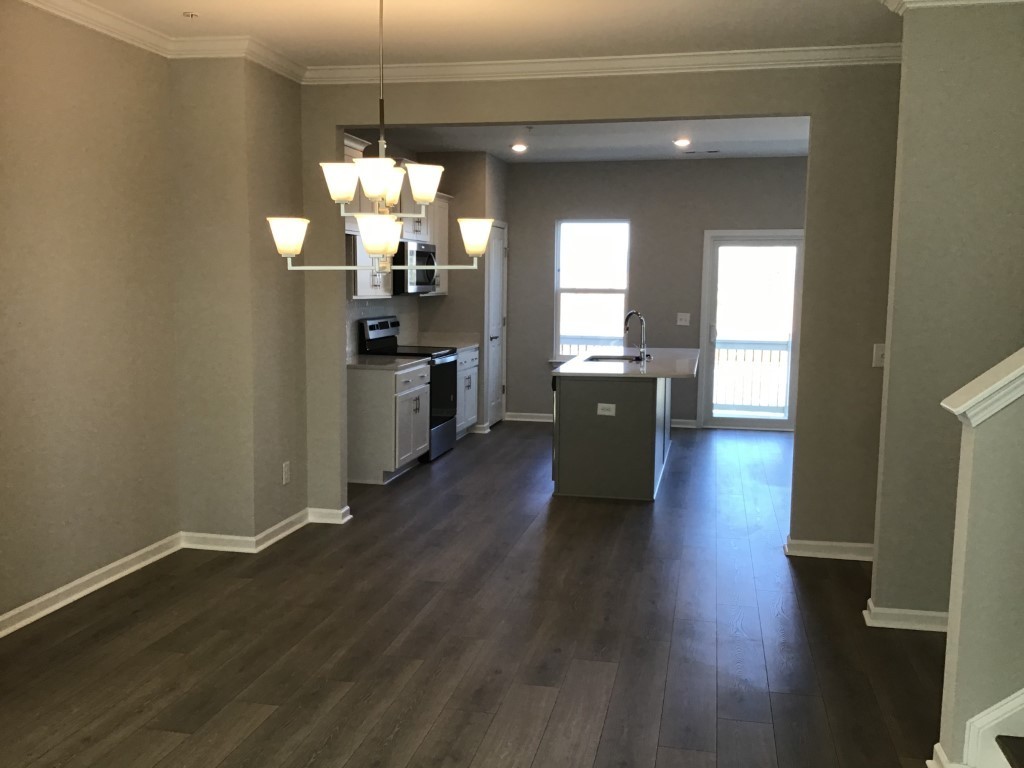 2400 Arden Village Drive, Unit G Columbia, TN 38401 - Photo 2 of 6 a kitchen with wooden floor and large windows