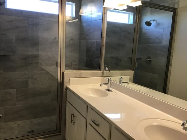 a bathroom with a sink and mirror