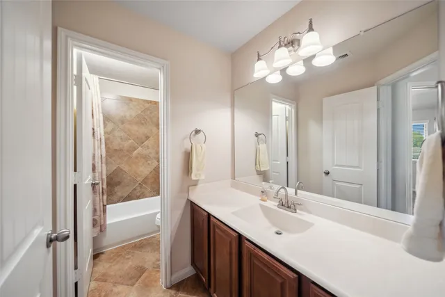 a bathroom with a sink double vanity and a mirror