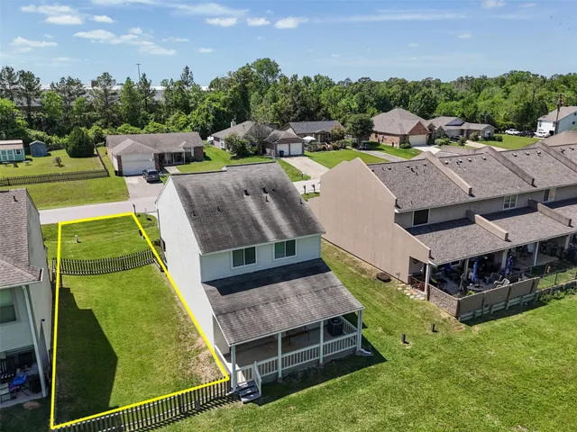 an aerial view of a house with a garden