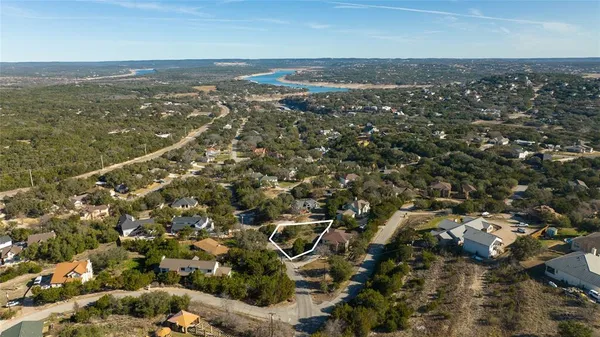 an aerial view of residential building with parking space