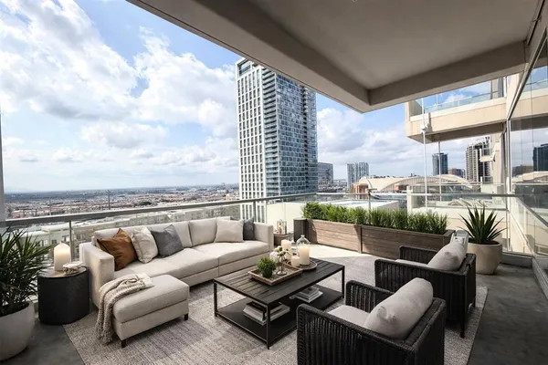a balcony with furniture and a couch