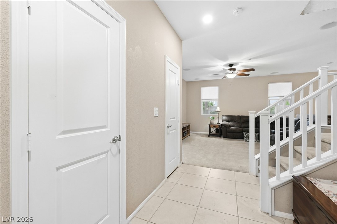 150 Fulgora Street Henderson, NV 89074 - Photo 22 of 92 Entryway/foyer with light carpet and light tile patterned floors