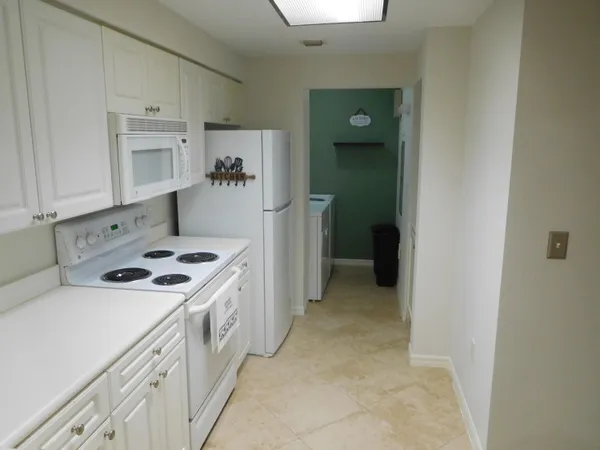 a kitchen with a stove and a refrigerator