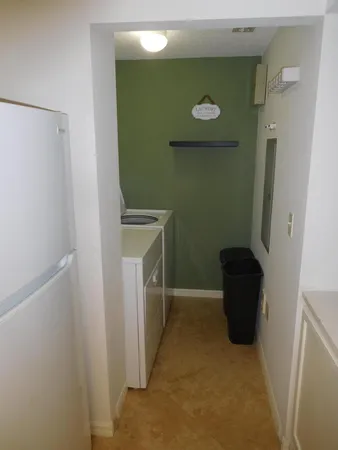 a view of a door and chair in a room