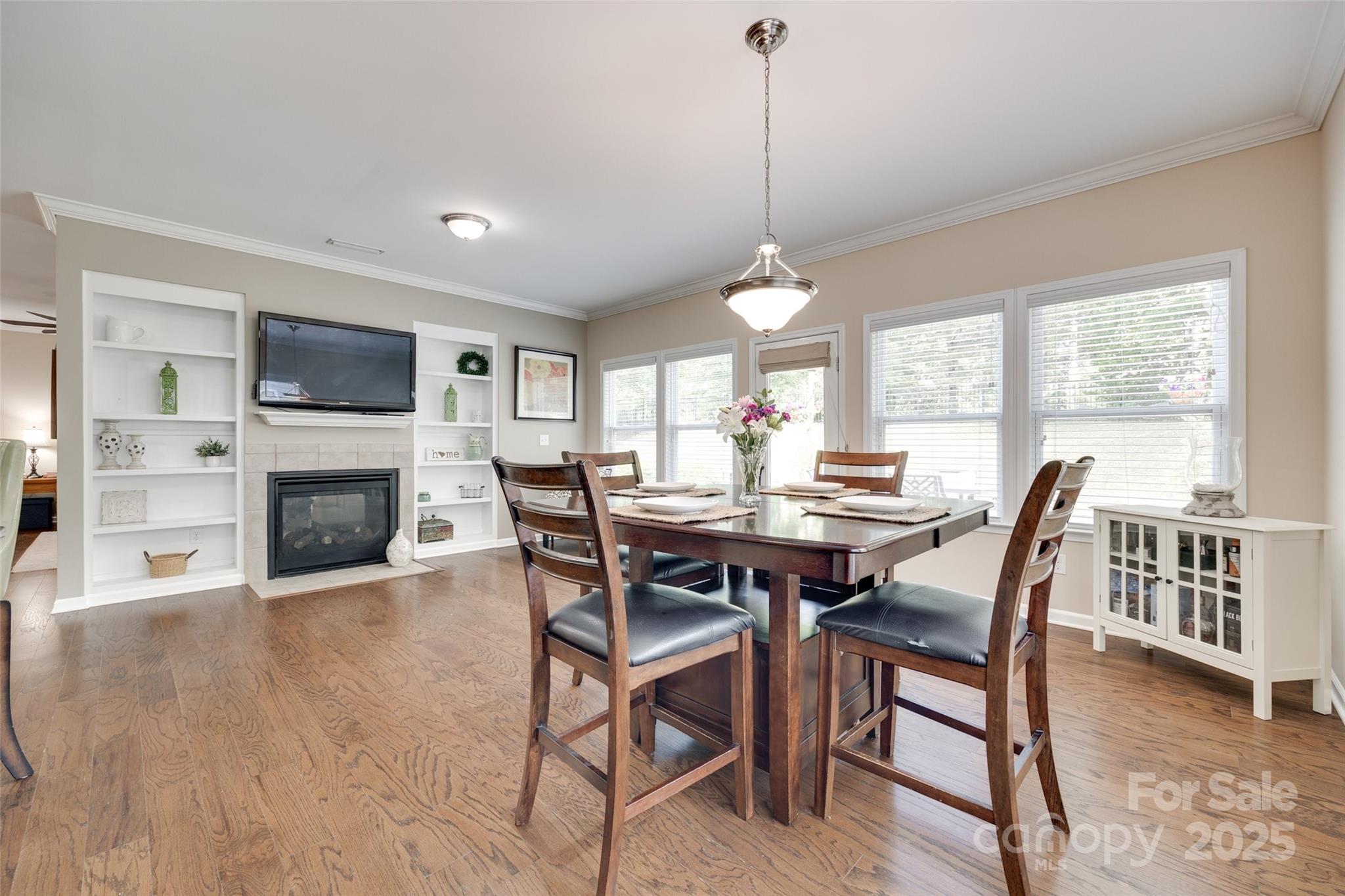 985 Angelica Lane Tega Cay, SC 29708 - Photo 14 of 47 a view of a dining room with furniture window and wooden floor