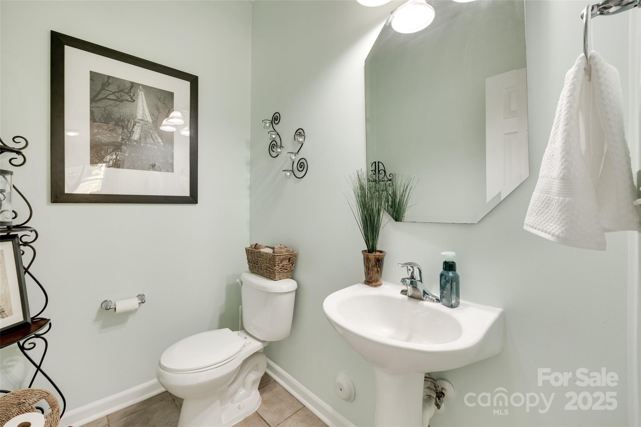 985 Angelica Lane Tega Cay, SC 29708 - Photo 19 of 47 a bathroom with a toilet sink and mirror