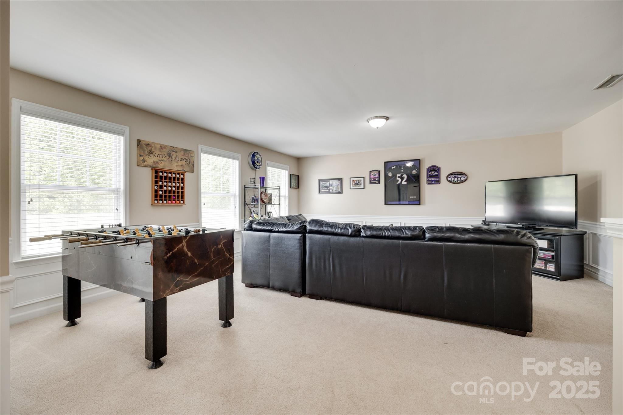 985 Angelica Lane Tega Cay, SC 29708 - Photo 20 of 47 a living room with furniture windows and a flat screen tv