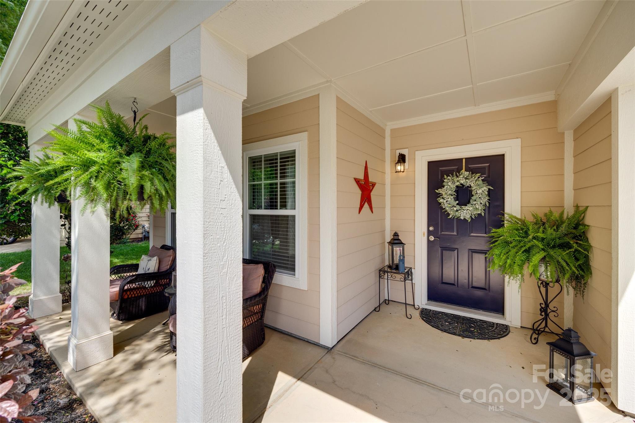 985 Angelica Lane Tega Cay, SC 29708 - Photo 2 of 47 a living room with furniture a potted plant and a window