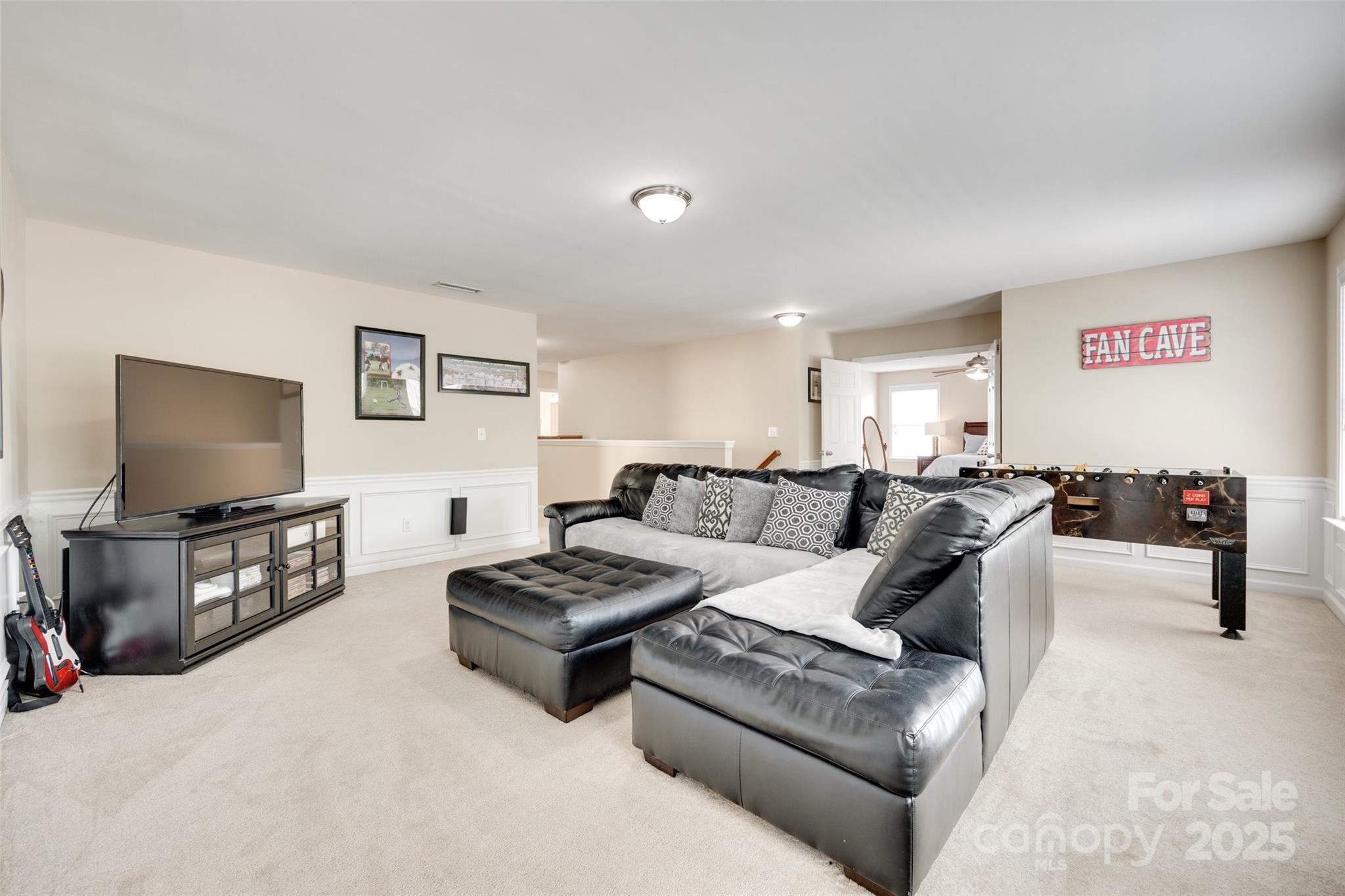985 Angelica Lane Tega Cay, SC 29708 - Photo 21 of 47 a living room with furniture and a flat screen tv