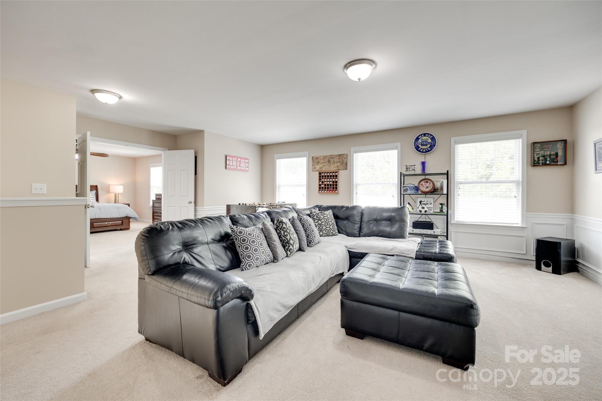 985 Angelica Lane Tega Cay, SC 29708 - Photo 22 of 47 a living room with furniture and a large window
