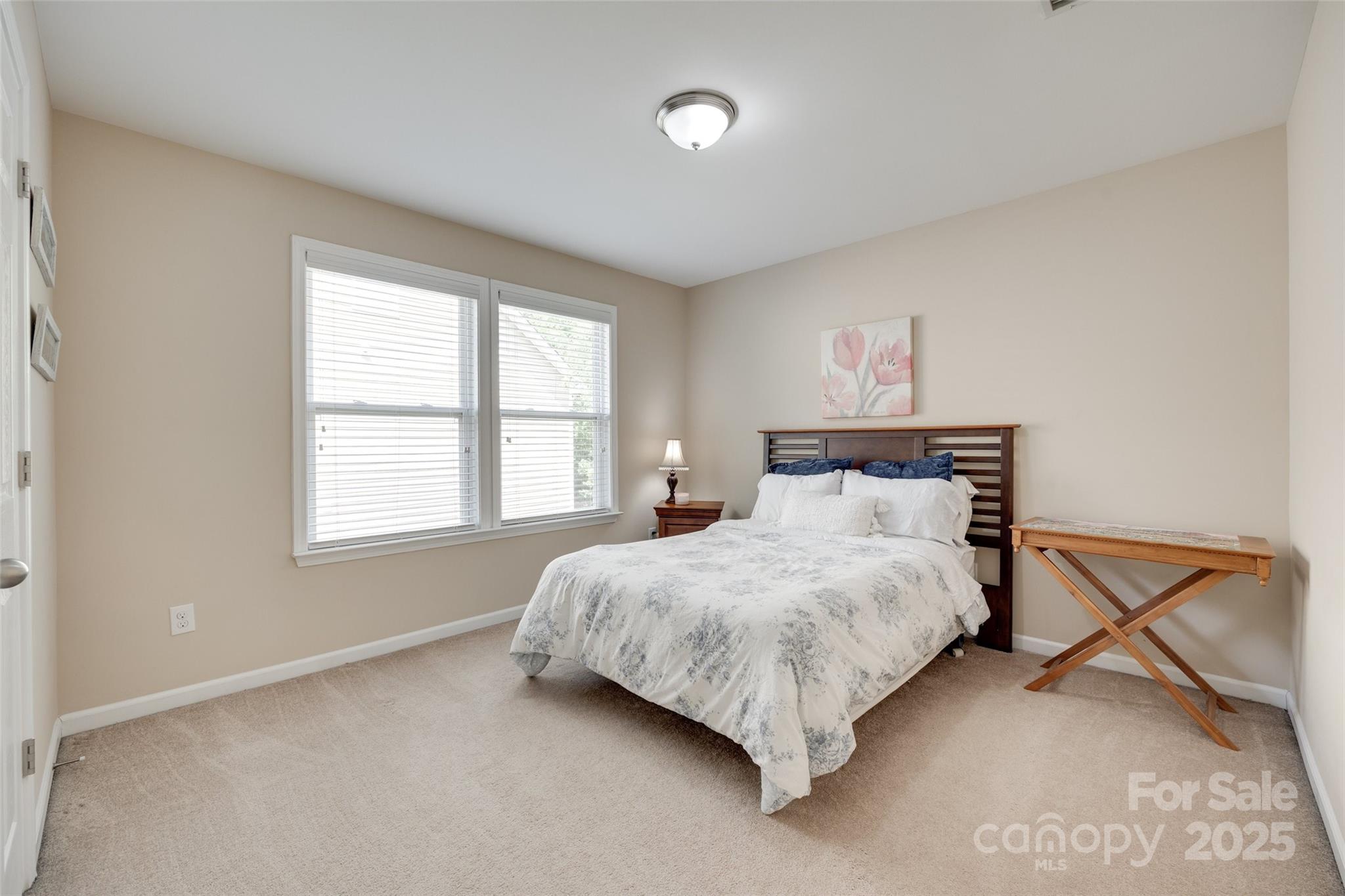 985 Angelica Lane Tega Cay, SC 29708 - Photo 23 of 47 a bedroom with a bed and a window