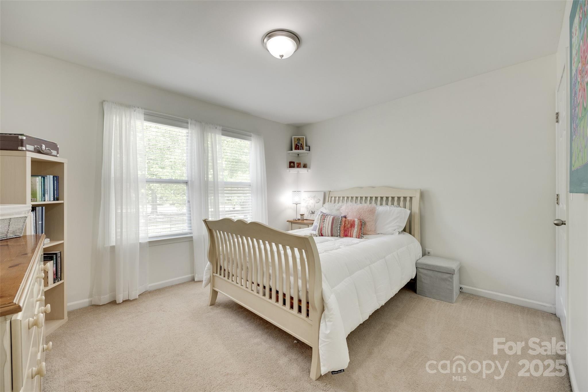 985 Angelica Lane Tega Cay, SC 29708 - Photo 27 of 47 a bedroom with a bed and a window