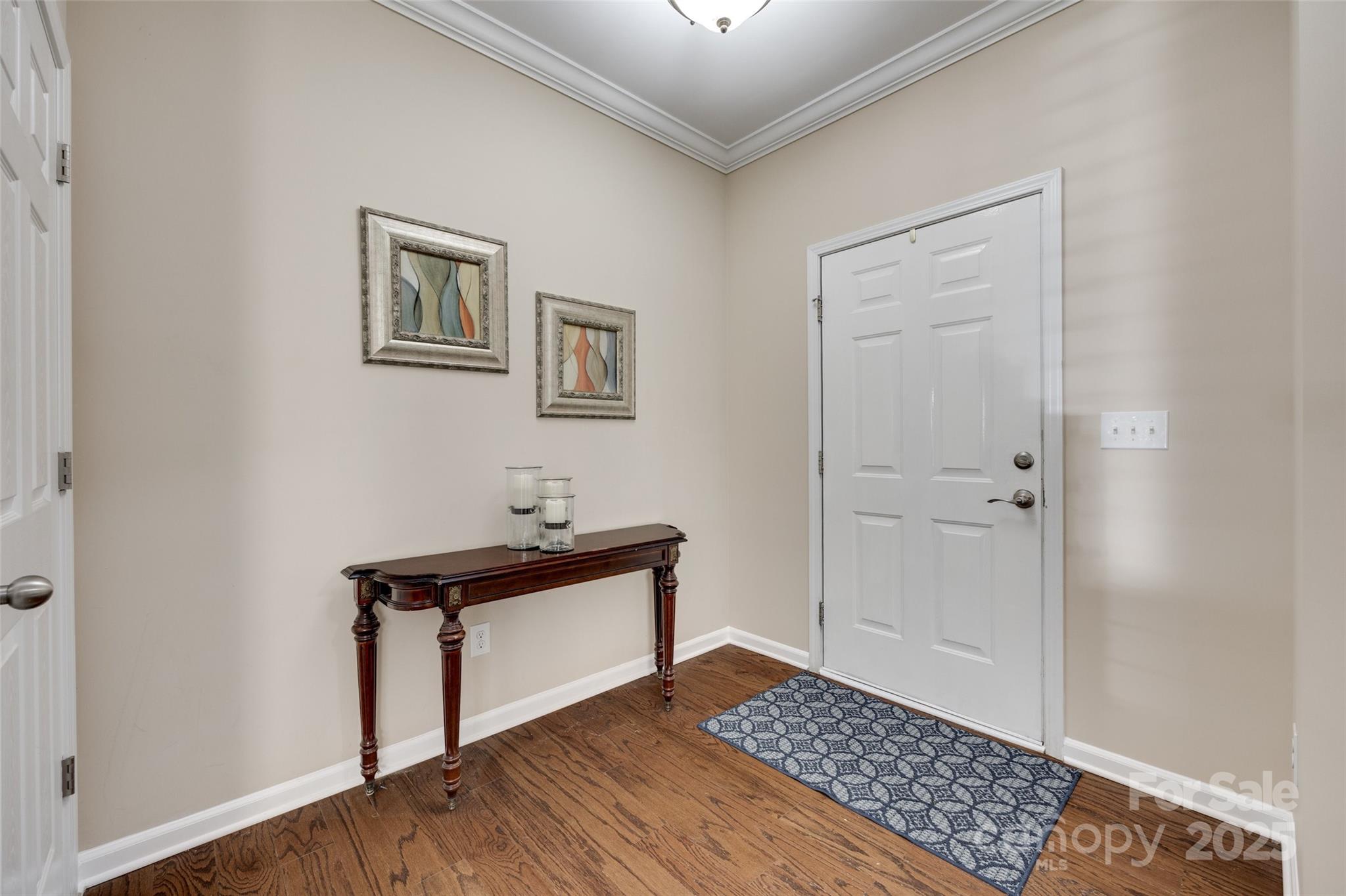 985 Angelica Lane Tega Cay, SC 29708 - Photo 3 of 47 a view of a livingroom with a hardwood and kitchen