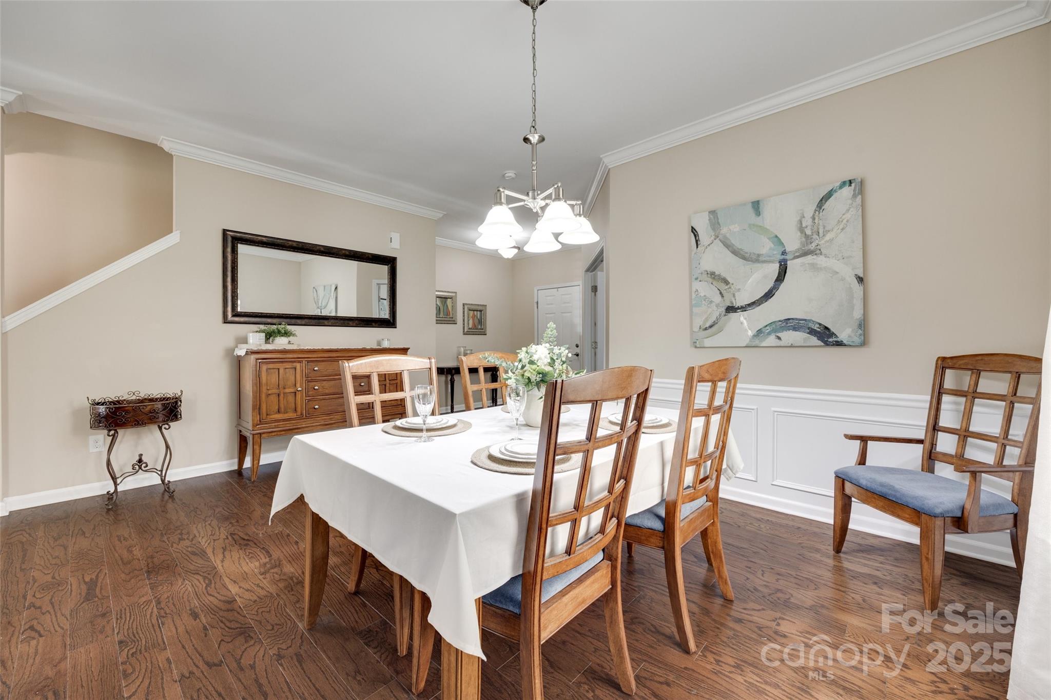 985 Angelica Lane Tega Cay, SC 29708 - Photo 7 of 47 a view of a dining room with furniture and wooden floor