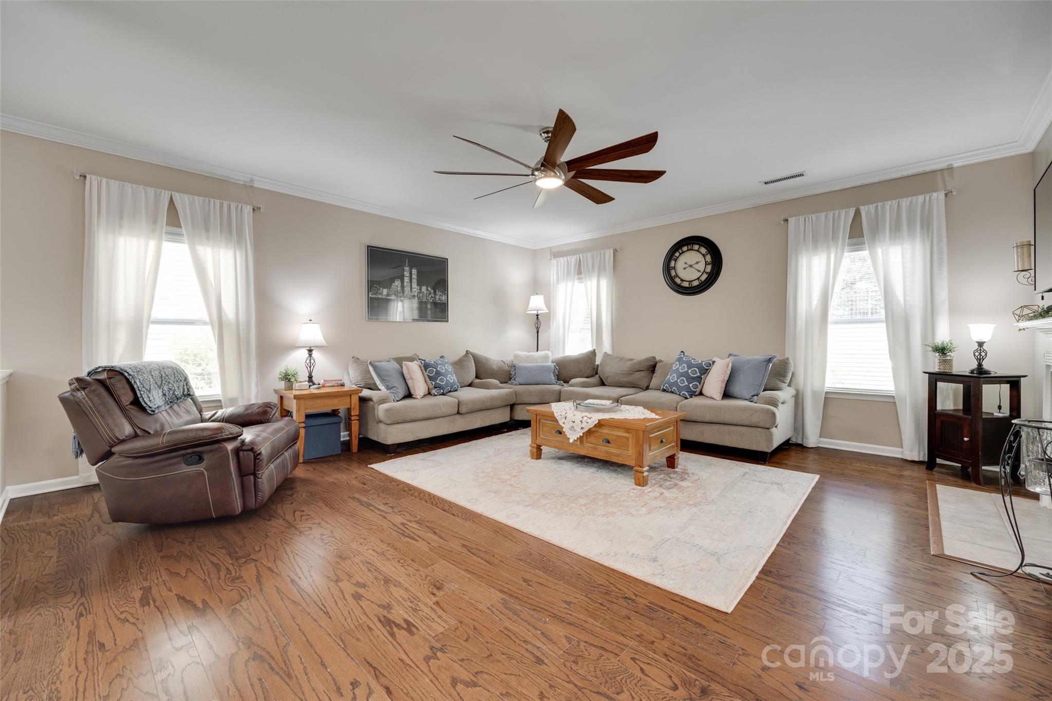 985 Angelica Lane Tega Cay, SC 29708 - Photo 8 of 47 a living room with furniture ceiling fan and a window