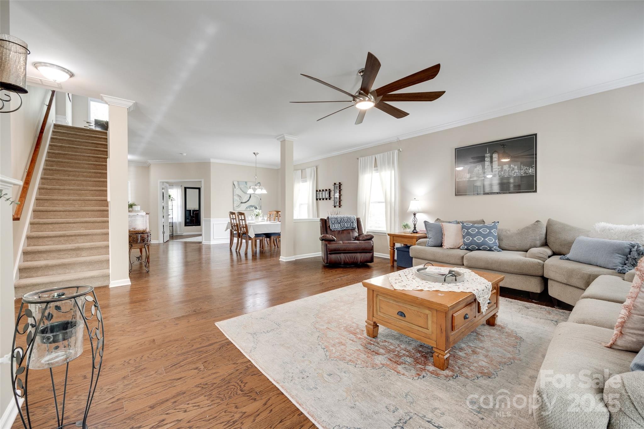 985 Angelica Lane Tega Cay, SC 29708 - Photo 9 of 47 a living room with furniture and a wooden floor