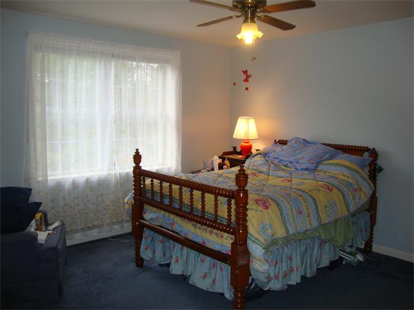 36 Easter Brook Road Lunenburg, MA 01462 - Photo 25 of 29 a bed room with a bed and a chandelier