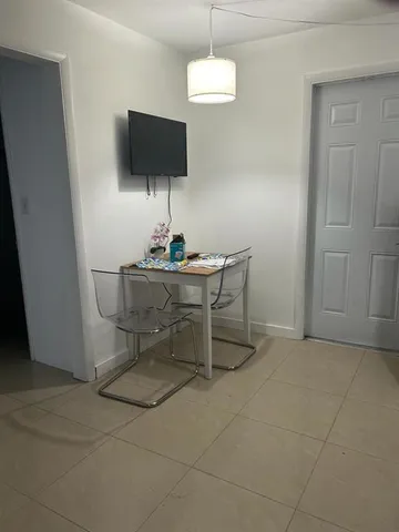 a kitchen with refrigerator a microwave and washer