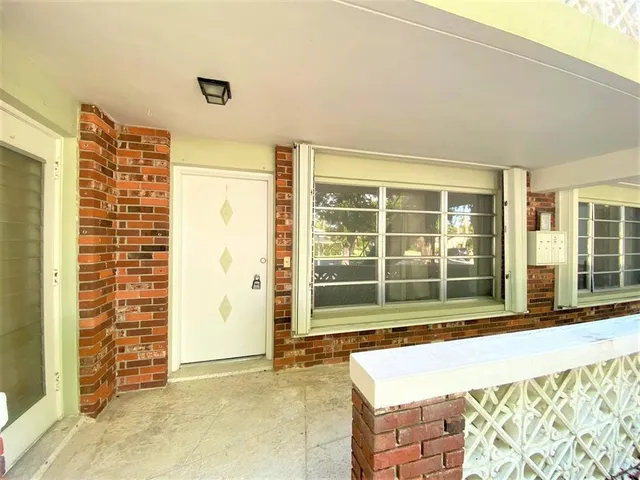 a bedroom with a bed and a chair