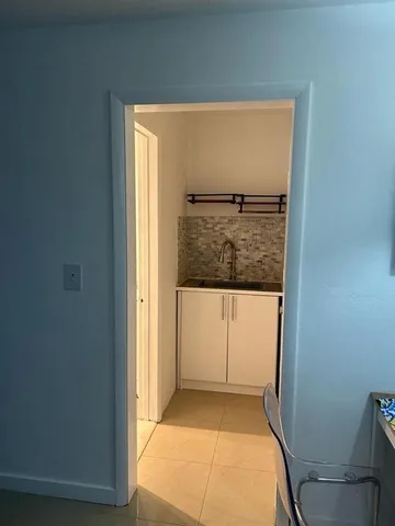 a workspace with furniture and a chandelier