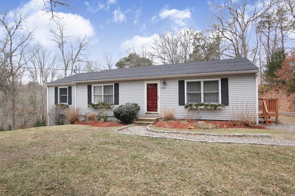 486 Cotuit Road Mashpee, MA 02649 - Photo 1 of 29 a front view of a house with a yard