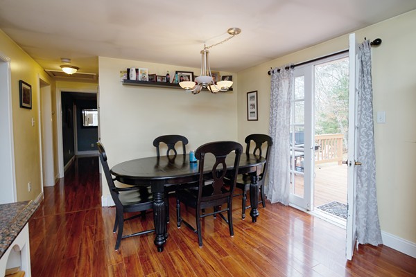 486 Cotuit Road Mashpee, MA 02649 - Photo 13 of 29 a view of a dining room with furniture and wooden floor
