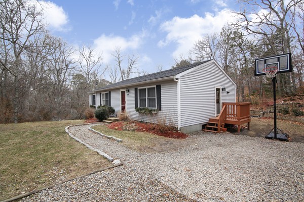 486 Cotuit Road Mashpee, MA 02649 - Photo 2 of 29 a view of a house with backyard