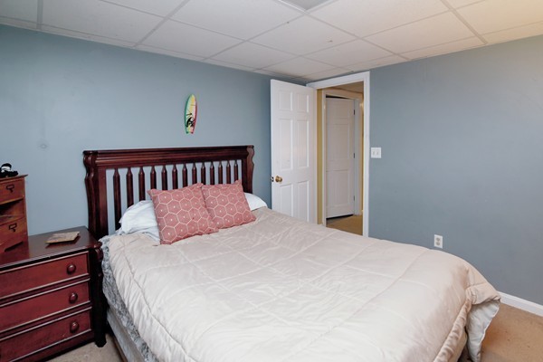486 Cotuit Road Mashpee, MA 02649 - Photo 25 of 29 a large bed sitting in a bedroom next to a window