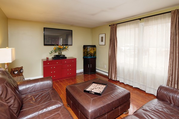 486 Cotuit Road Mashpee, MA 02649 - Photo 4 of 29 a living room with furniture and a flat screen tv