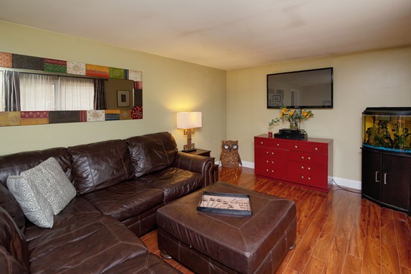 486 Cotuit Road Mashpee, MA 02649 - Photo 5 of 29 a living room with furniture and a flat screen tv