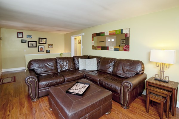486 Cotuit Road Mashpee, MA 02649 - Photo 6 of 29 a living room with furniture and a wooden floor