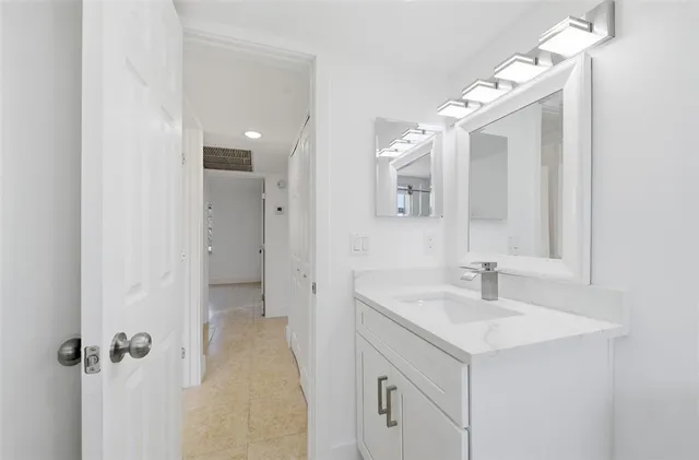 a bathroom with a sink and mirror