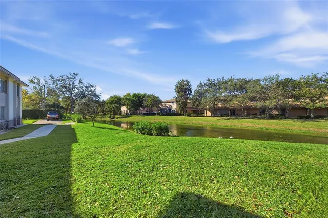 a view of a golf course with a lake