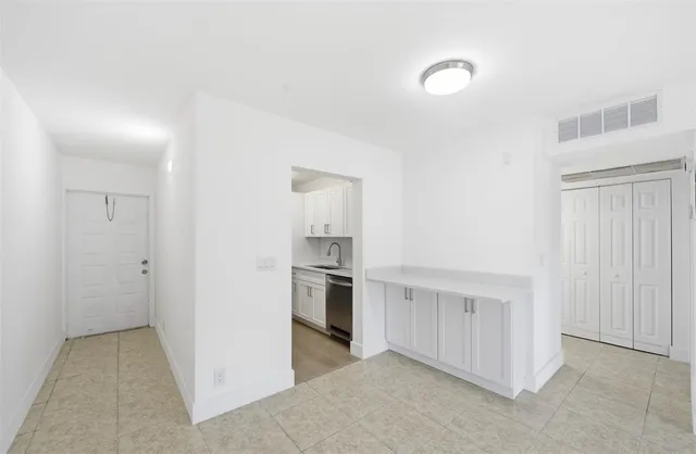a view of a kitchen with a sink