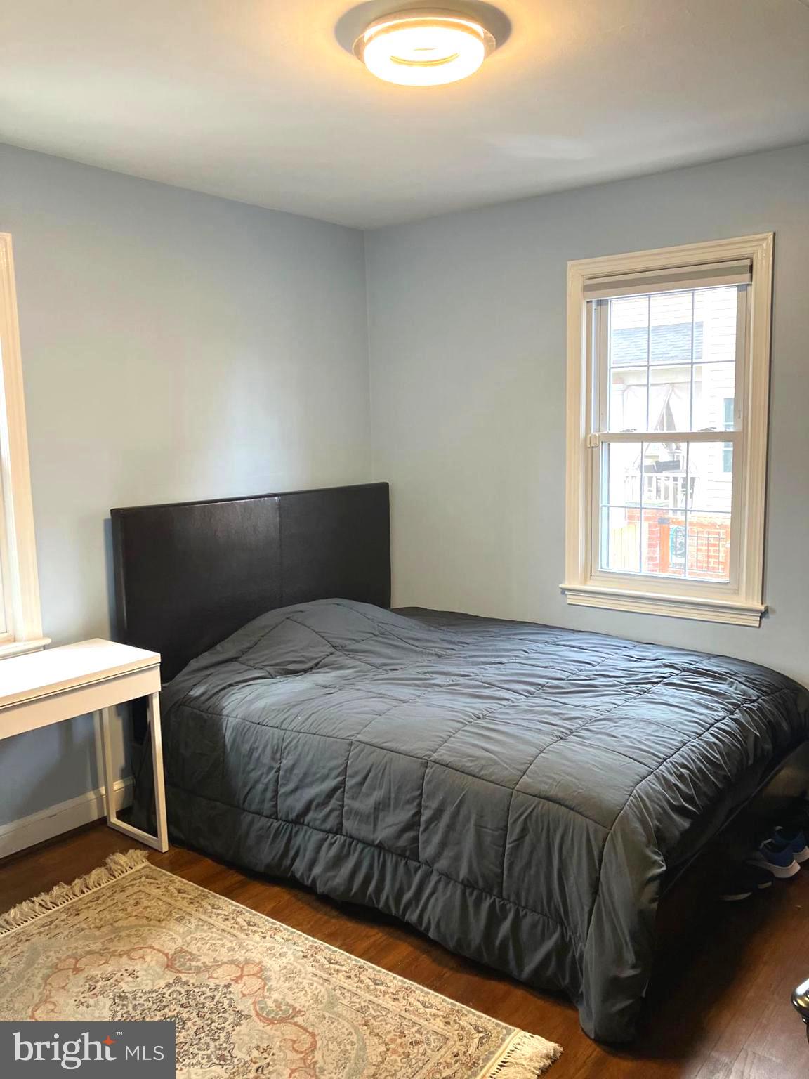 626 South Irving Street Arlington, VA 22204 - Photo 11 of 28 a bedroom with a bed and a window