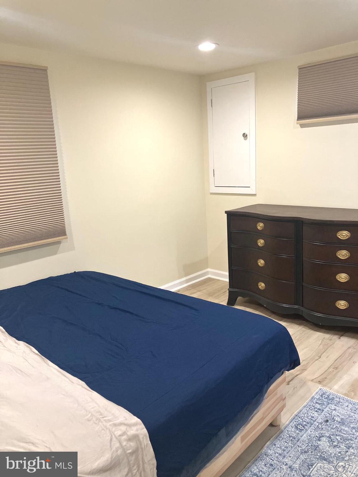 626 South Irving Street Arlington, VA 22204 - Photo 17 of 28 a bedroom with a bed and a dresser